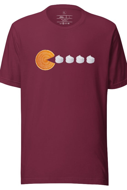 Level up your style with our playful t-shirt featuring a pumpkin pie shaped like Pac-Man devouring whipped cream swirls on a maroon shirt. 