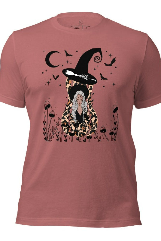 Elevate your Halloween style with our striking shirt featuring a cheetah print squash and a stylish lady donning a witch hat adorned with flowers and bats. Embrace the enchanting fusion of nature and magic on a mauve colored shirt. 