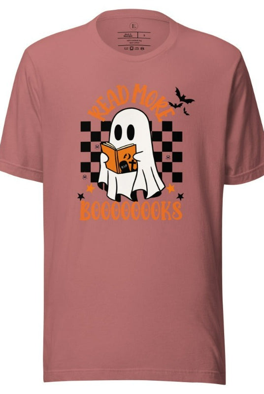 Read More Booooks is a ghost reading a book in front of a checkered background on a mauve colored shirt. 