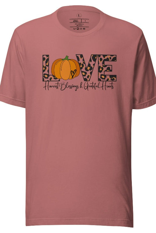 Spread love and autumn vibes with our trendy t-shirt. Featuring the word 'love' in cheetah print with a pumpkin as the 'o,' and "Harvest Blessings and Grateful Hearts' underneath on a mauve shirt. . 