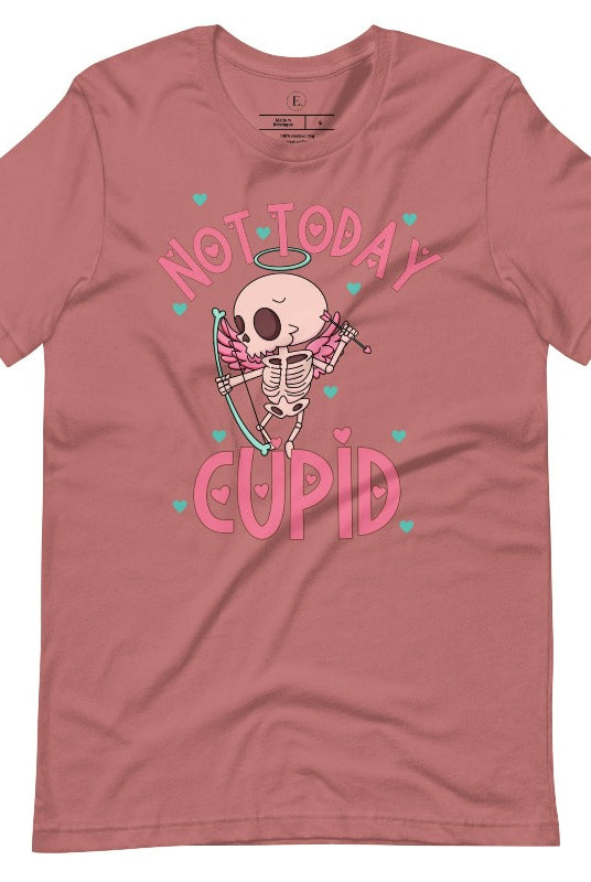 Unleash your rebellious spirit this Valentine's Day with our edgy shirt featuring a skeleton Cupid. The bold "Not Today Cupid" message adds a touch of attitude, making this tee a standout choice for those who march to the beat of their own drum on a mauve shirt. 