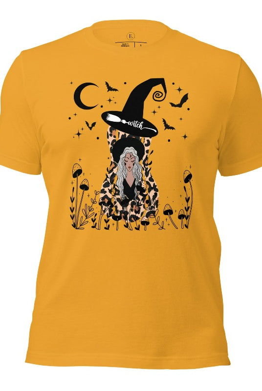 Elevate your Halloween style with our striking shirt featuring a cheetah print squash and a stylish lady donning a witch hat adorned with flowers and bats. Embrace the enchanting fusion of nature and magic on a mustard colored shirt. 