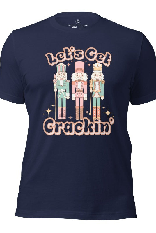 Get into the festive groove with our Christmas Nutcracker shirt that exclaims, "Let's Get Crackin'!" on a navy colored shirt. 