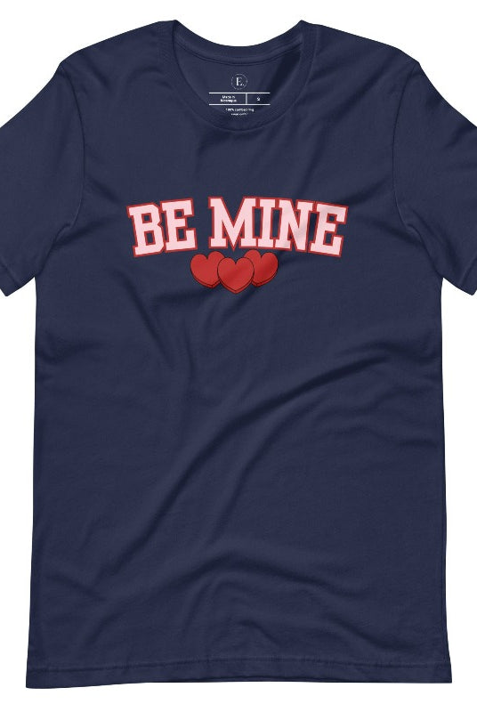 Elevate your Valentine's Day style with our "Be Mine" shirt! Featuring bold athletic lettering and three adorable hearts, on a navy shirt. 
