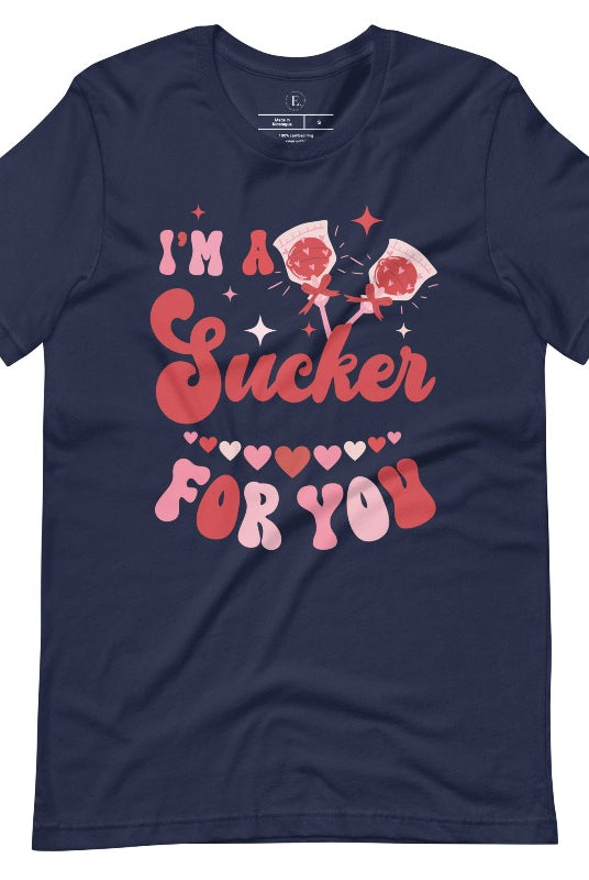 Indulge in the spirit of love with our Valentine's Day shirt! Adorned with charming Valentine lollipops and the playful saying, "I'm a sucker for you," on a navy shirt. 