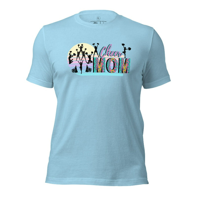 Get your cheer on with our stylish cheer mom shirt. Perfect for proud moms supporting their cheering stars. Made with love, this shirt combines comfort and fashion, letting you show off your team spirit. Join the cheer squad and cheer your heart out in style on an ocean blue shirt.