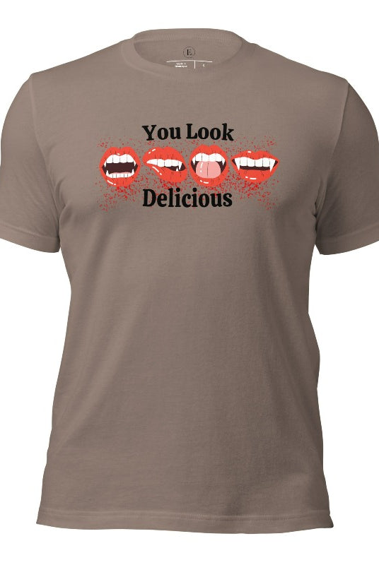 Indulge in wickedly delightful style with our vampire lips shirt. Featuring alluring lips dripping with Halloween allure, this shirt captivates with its seductive charm. The cheeky message, 'You Look Delicious,' on a pebble colored shirt. 