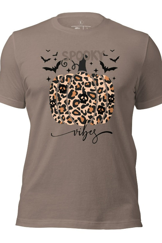 Get into Halloween spirit with our spooky vibes shirt featuring a unique cheetah print pumpkin adorned with skulls. As bats soar across the starry sky, embrace the eerie charm of this one-of-a-kind design on a pebble colored shirt. 