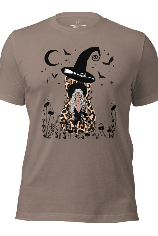 Elevate your Halloween style with our striking shirt featuring a cheetah print squash and a stylish lady donning a witch hat adorned with flowers and bats. Embrace the enchanting fusion of nature and magic on a pebble colored shirt. 