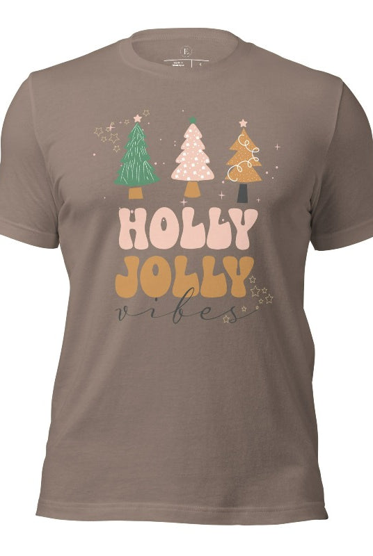 Get ready to feel the holly jolly vibes with our Christmas shirt! This festive shirt features a playful message that reads "Holly Jolly Vibes" and is adorned with cheerful Christmas trees, radiating the holiday cheer on a pebble shirt.