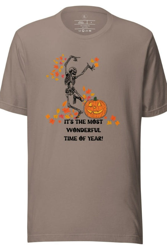 Dancing Skeleton in fall leaves with a jack-o-lantern with saying "It's the most wonderful time of year" on a pebble colored shirt.