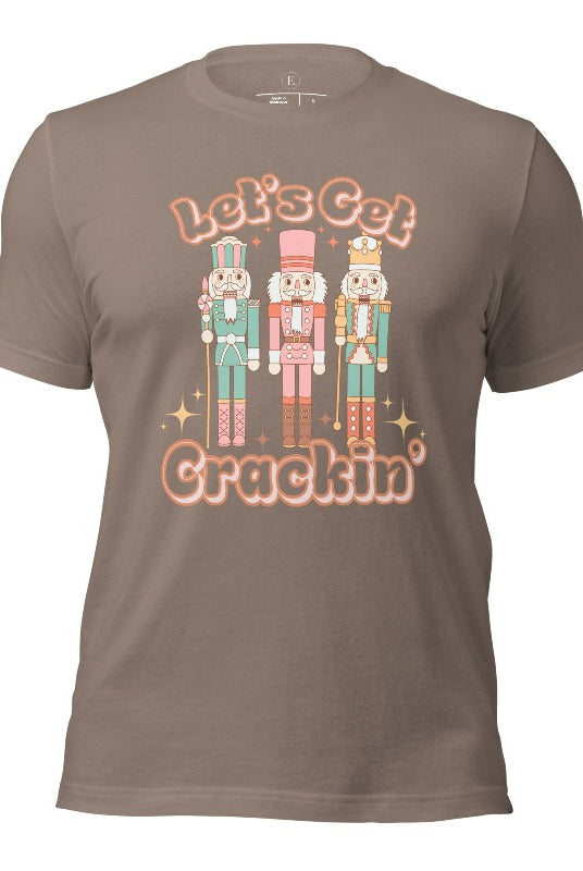 Get into the festive groove with our Christmas Nutcracker shirt that exclaims, "Let's Get Crackin'!'" on a pebble colored shirt. 