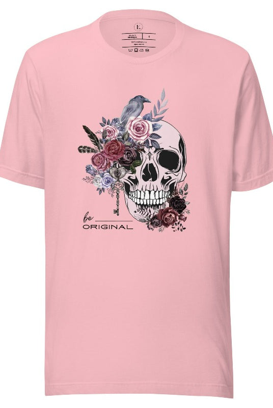 Looking for a unique Halloween shirt? Look no further! Our hauntingly beautiful shirt features a floral skull, raven, and the empowering slogan 'Be Original'. Stand out from the crowd with this unforgettable statement piece on a pink shirt. 