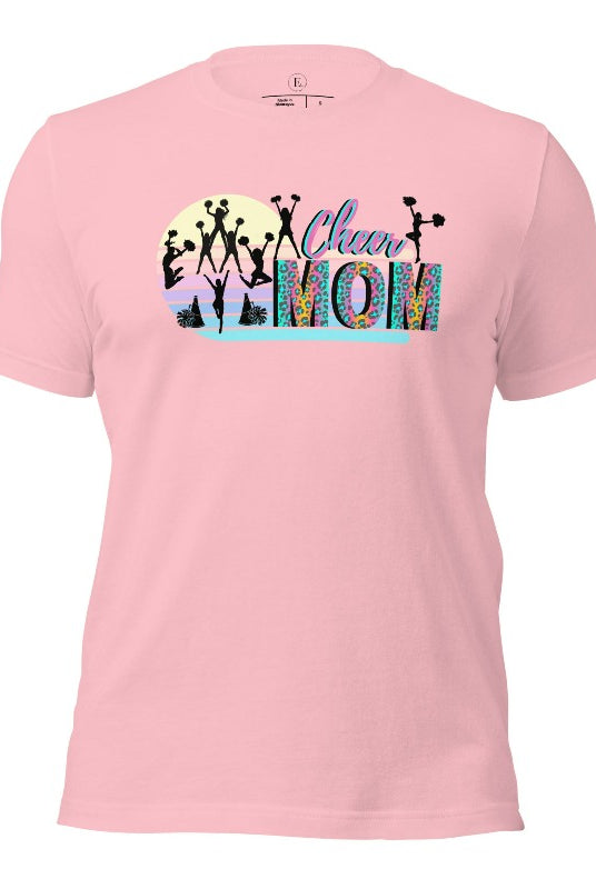 Get your cheer on with our stylish cheer mom shirt. Perfect for proud moms supporting their cheering stars. Made with love, this shirt combines comfort and fashion, letting you show off your team spirit. Join the cheer squad and cheer your heart out in style on a pink shirt. 
