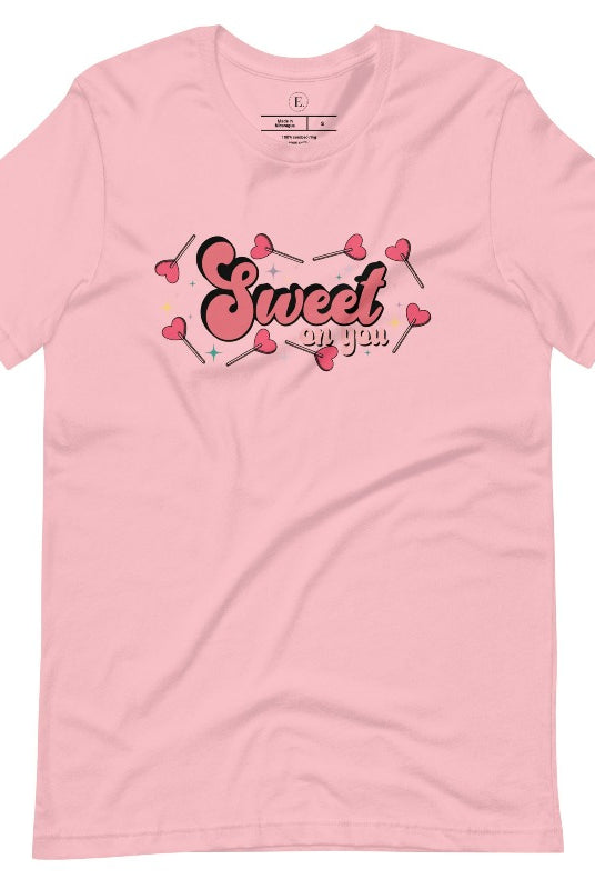 Spread the love with our charming Valentine's Day shirt featuring the endearing phrase " Sweet on You" surrounded by heart lollipops on a pink shirt. 