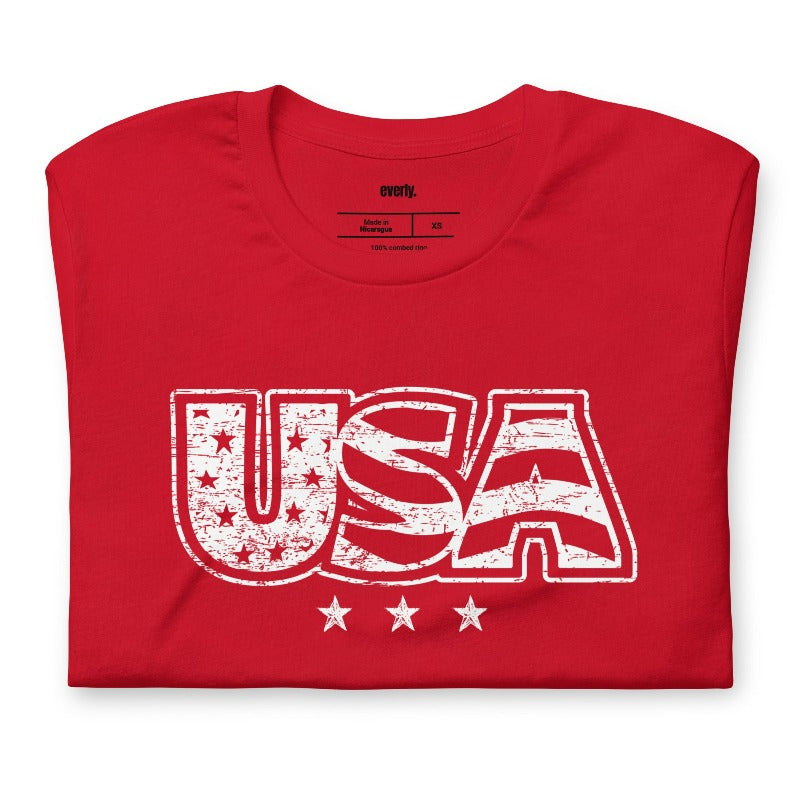 The alt text for the product photo could be: "Graphic tee with faded lettering of 'USA' on the front, in Red color - perfect for celebrating July 4th.