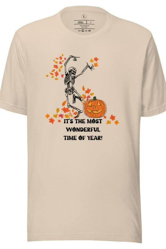 Dancing Skeleton in fall leaves with a jack-o-lantern with saying "It's the most wonderful time of year" on a soft cream colored shirt.