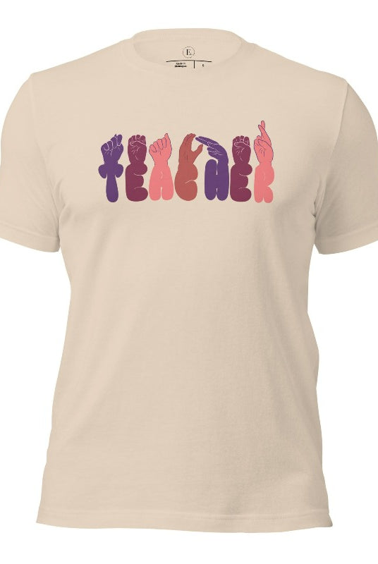 Let's celebrate our educators with this unique ASL teacher t-shirt. The word "teacher" is spelled out in American Sign Language using expertly crafted hands, highlighting their vital role in shaping our society. ASL teacher on a soft cream colored shirt.