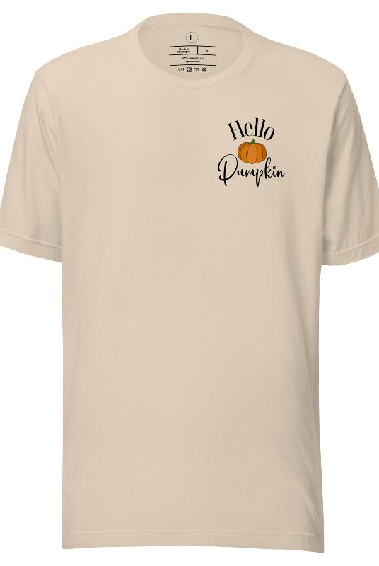 Say hello to autumn with our adorable t-shirt. It features a pumpkin on the front pocket and the playful phrase 'Hello Pumpkin,' this design captures the spirit of the season on a soft cream colored shirt. 
