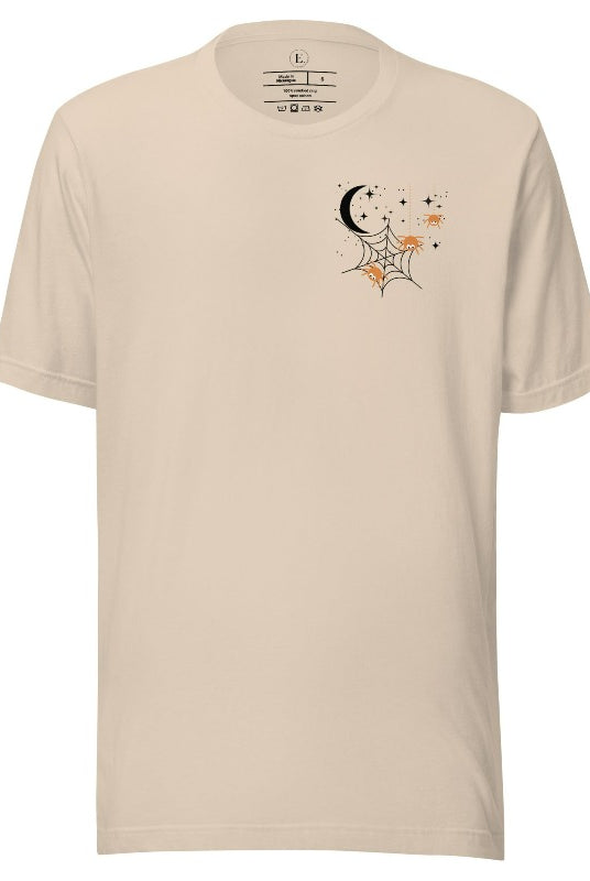Embrace the enchanting night sky with our captivating t-shirt. Featuring a crescent moon, stars, and a spiderweb with three adorable spiders hanging down on the front pocket on a soft cream shirt. 