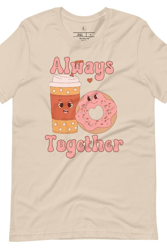 Celebrate love with our adorable Valentine's Day graphic tee! Featuring a smiling coffee cup and a cheerful donut holding hands, on a soft cream shirt. 