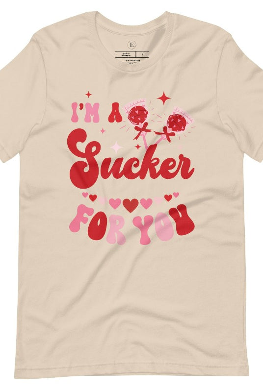 Indulge in the spirit of love with our Valentine's Day shirt! Adorned with charming Valentine lollipops and the playful saying, "I'm a sucker for you," on a soft cream shirt. 