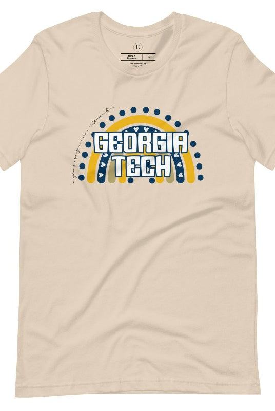 Elevate your Georgia Tech pride with this boho-inspired university t-shirt. The Georgia Tech colors shine through on a vibrant rainbow background, showcasing the school's name in a trendy and unique way on a soft cream shirt. 