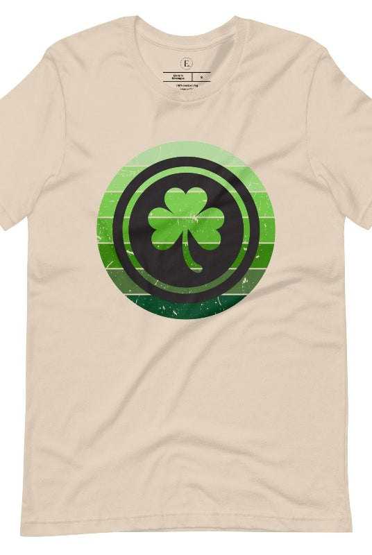 Get your ultimate Saint Patrick's Day attire with our Bella Canvas 3001 unisex graphic t-shirt! Featuring a captivating circle design in various shades of green, topped with a prominent shamrock, on a soft cream colored shirt. 