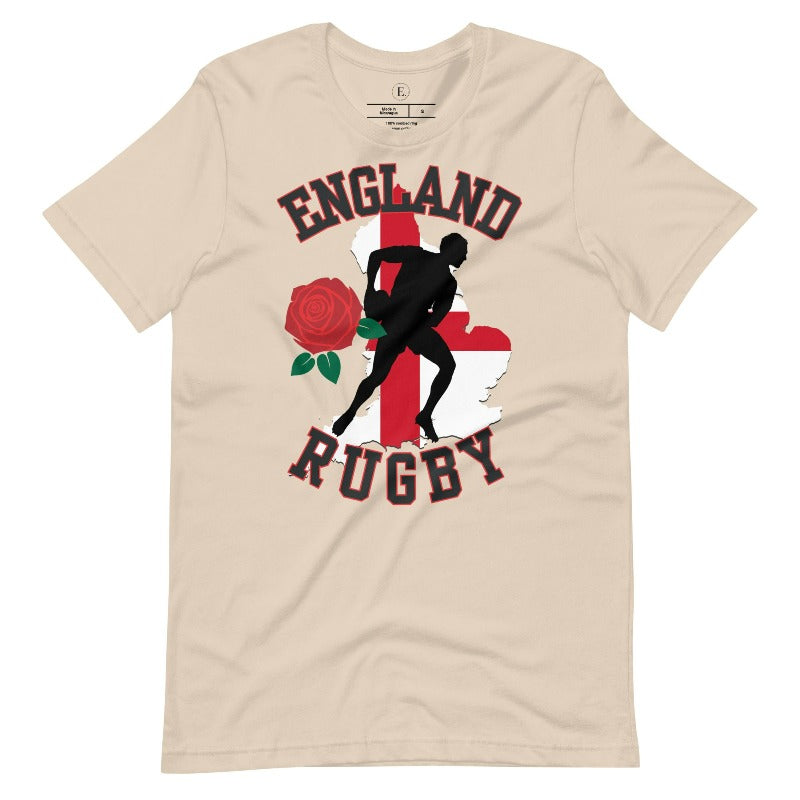 Introducing our England Rugby Graphic T-Shirt - the ultimate fusion of patriotism, rugby pride, and contemporary style! This captivating t-shirt features the words "England Rugby" and the iconic England flag artfully incorporated within the outline of the country, accompanied by a dynamic rugby player graphic on a soft cream colored shirt. 