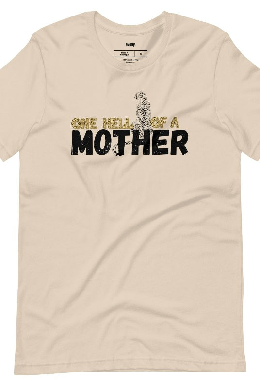 "One Hell of a Mother" Graphic Tee - The Ultimate Mama Shirt for Stylish Moms on a tan graphic tees. 