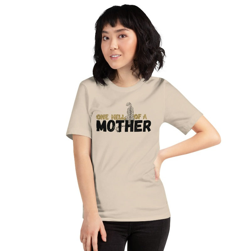 "One Hell of a Mother" Graphic Tee - The Ultimate Mama Shirt for Stylish Moms on a tan graphic tees. 