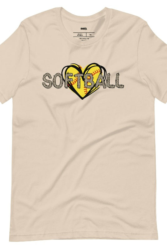 Cheetah print softball lettering on top of a softball heart on a soft cream graphic tee.