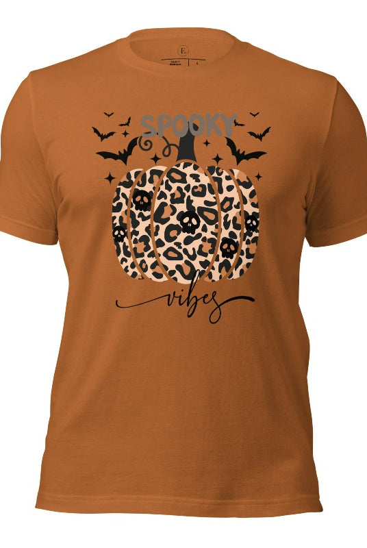 Get into Halloween spirit with our spooky vibes shirt featuring a unique cheetah print pumpkin adorned with skulls. As bats soar across the starry sky, embrace the eerie charm of this one-of-a-kind design on a toast colored shirt. 