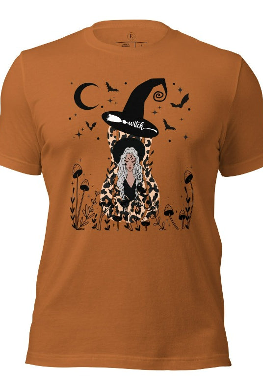 Elevate your Halloween style with our striking shirt featuring a cheetah print squash and a stylish lady donning a witch hat adorned with flowers and bats. Embrace the enchanting fusion of nature and magic on a taost colored shirt. 
