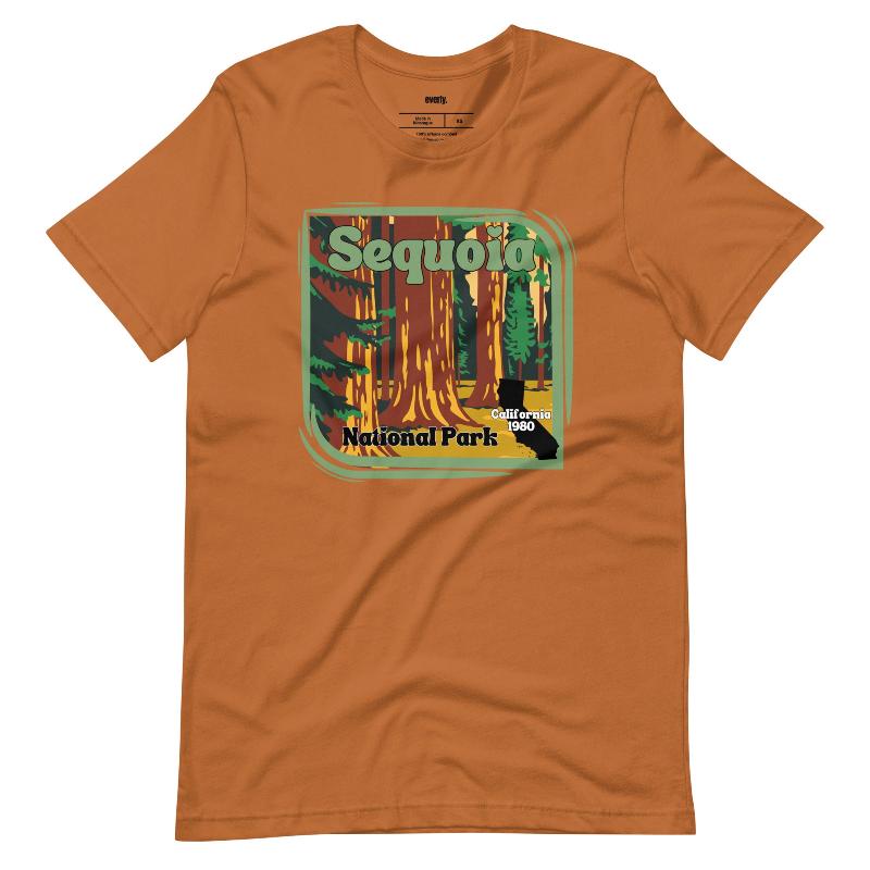 a vibrant illustration of Sequoia National Park, showcasing towering sequoia trees with a vintage-inspired design on a toast shirt.