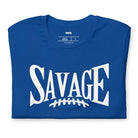 "Savage" in large, bold white letters with a football graphic underneath. The shirt is from Bella + Canvas and is made of 100% combed and ring-spun cotton on a blue shirt