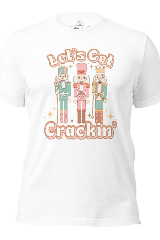 Get into the festive groove with our Christmas Nutcracker shirt that exclaims, "Let's Get Crackin'!" on a white colored shirt. 