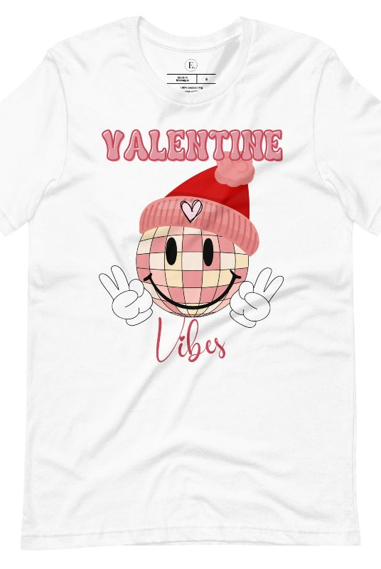 Get into the Valentine's Day spirit with our fun and funky shirt donning the words "Valentine Vibes" alongside a disco ball smiley face flashing peace fingers on a white shirt. 