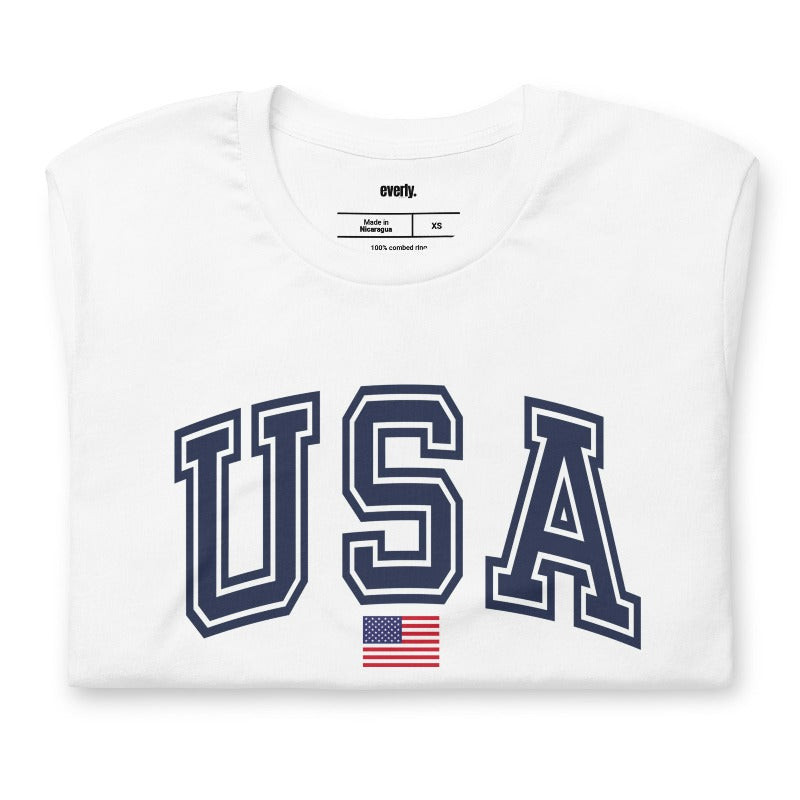 Red, white, and blue graphic tee featuring bold 'USA' lettering on the front, perfect for July 4th celebrations and patriotic events on a white graphic tee.