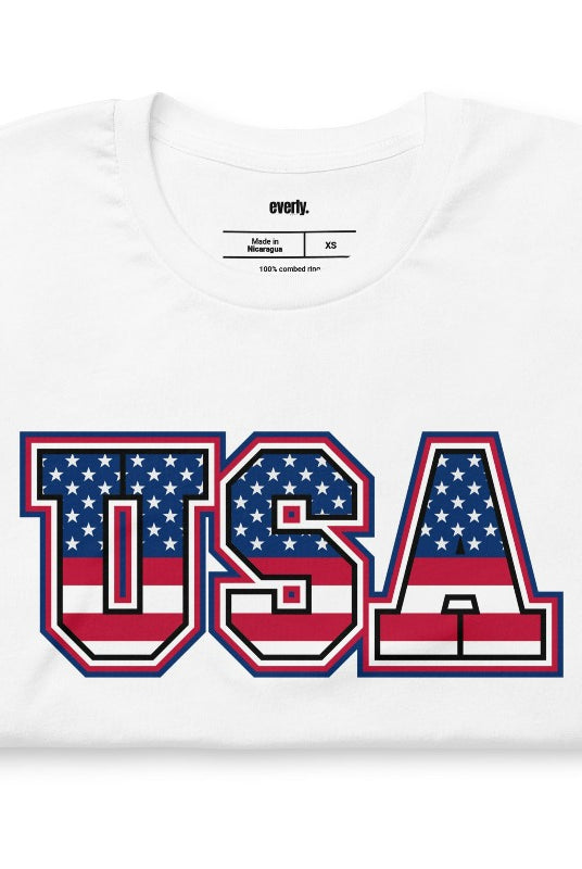 Eye-catching USA July 4th graphic tee showcasing 'USA' in vibrant American flag patterns on the front, adding a patriotic and bold statement to your wardrobe.