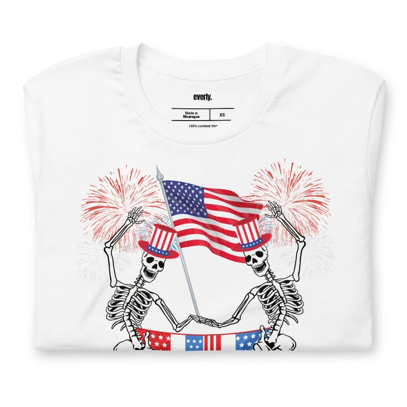 Skeletons celebrating July 4th white graphic tee.
