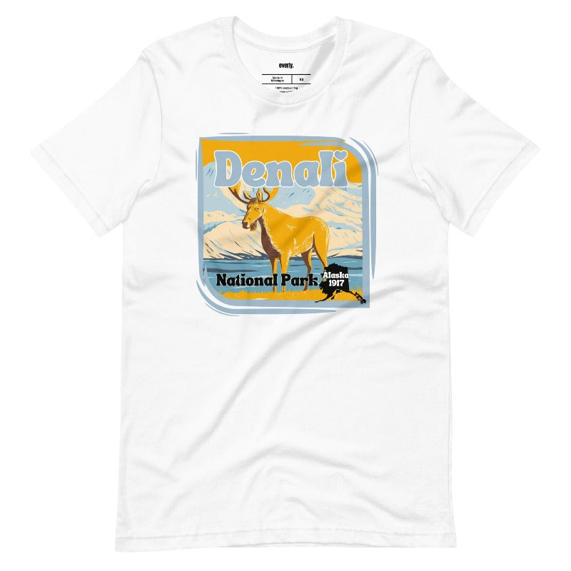 White Bella + Canvas 3001 t-shirt featuring a colorful Denali National Park graphic with a moose and mountains, showcasing the beauty of Alaska's wilderness.