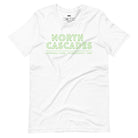 a vibrant, retro-style design of North Cascades National Park on the back, and "North Cascades National Park | Washington - 1968" text on the front on a white shirt.