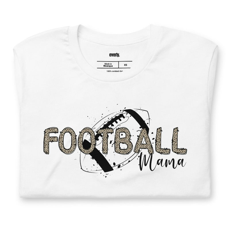 a playful design with a football graphic and the words "Football Mama" in leopard print on a white shirt.