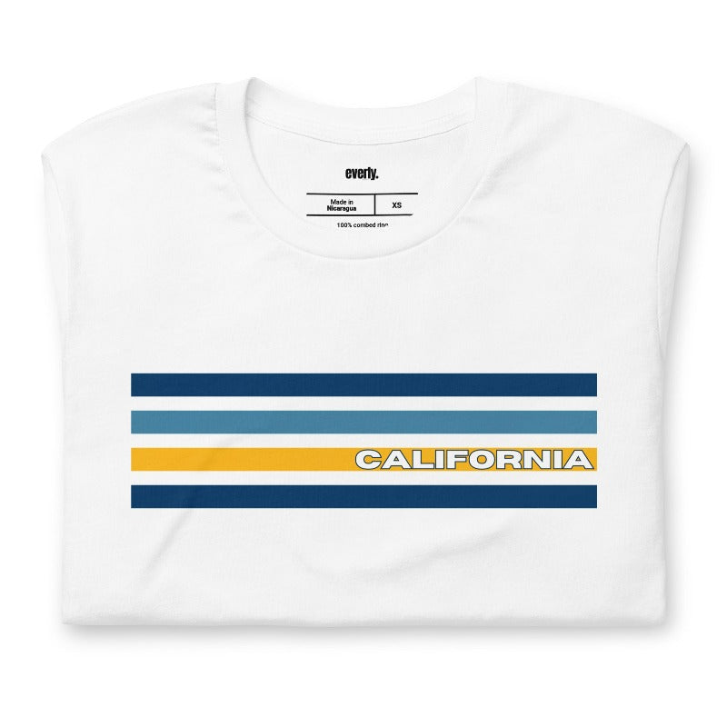 Bella + Canvas 3001 unisex t-shirt featuring bold blue and gold horizontal stripes with the word "CALIFORNIA" prominently displayed in the center on a white shirt