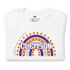 Bella + Canvas 3001 unisex shirt featuring a colorful rainbow design with the word "Clemson" in the center, representing Clemson University on a white graphic tee.