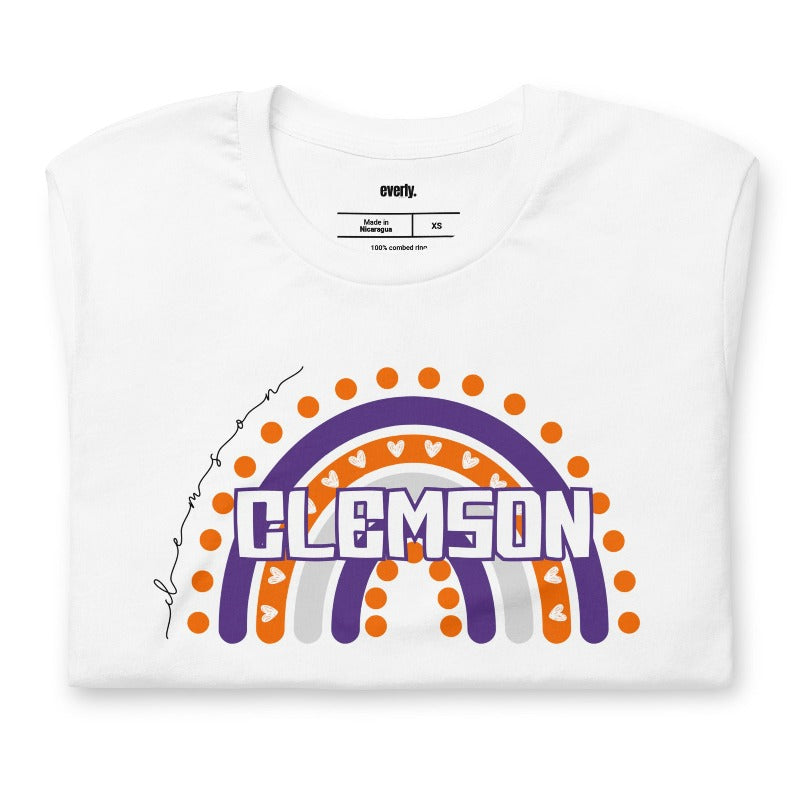 Bella + Canvas 3001 unisex shirt featuring a colorful rainbow design with the word "Clemson" in the center, representing Clemson University on a white graphic tee.