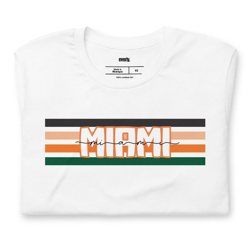 Bella + Canvas 3001 unisex t-shirt featuring the University of Miami design with black, orange, and green stripes and "Miami" text in the center on a white shirt.