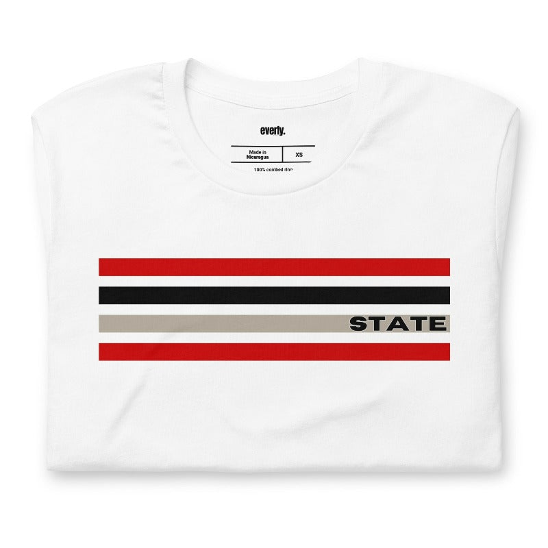 Bold red, black, and grey stripes with "STATE" text for NC State on a white shirt.