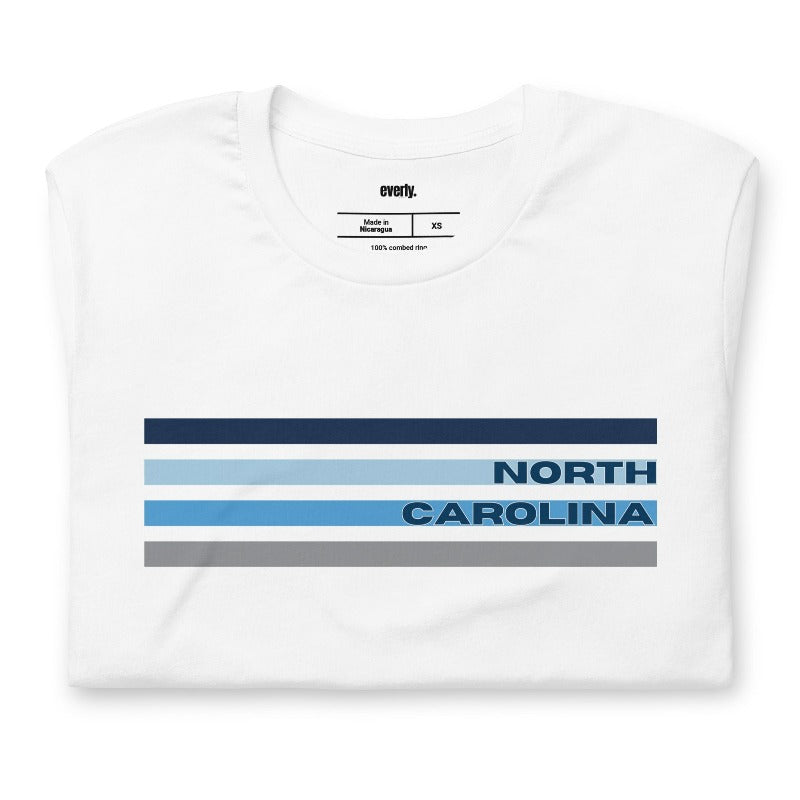 a design featuring blue stripes and "North Carolina" text on a white shirt.